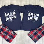 Matching Lapland pyjamas with navy T-shirts, white hanging bobble hats, The Waltons family name, 2026 and red and navy tartan bottoms.
