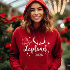 Woman wearing a red Off to Find Santa Lapland hoodie for 2026