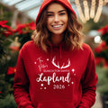 Woman wearing a red personalised Search for Santa 2026 Lapland hoodie