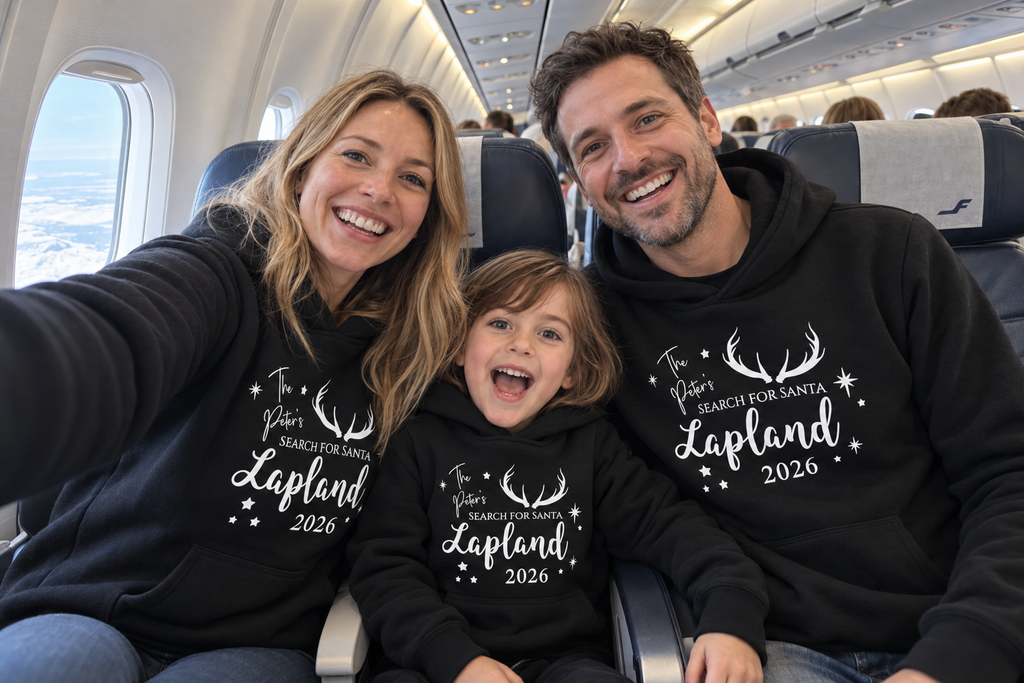Family wearing matching black Search for Santa hoodies while travelling to Lapland