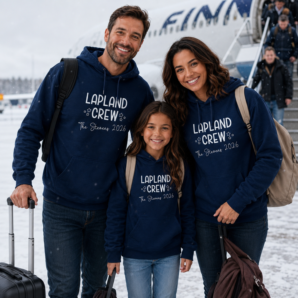 Family wearing matching navy personalised Lapland Crew 2026 hoodies