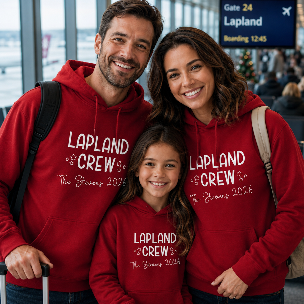 Close-up of a family wearing matching personalised Lapland Crew hoodies